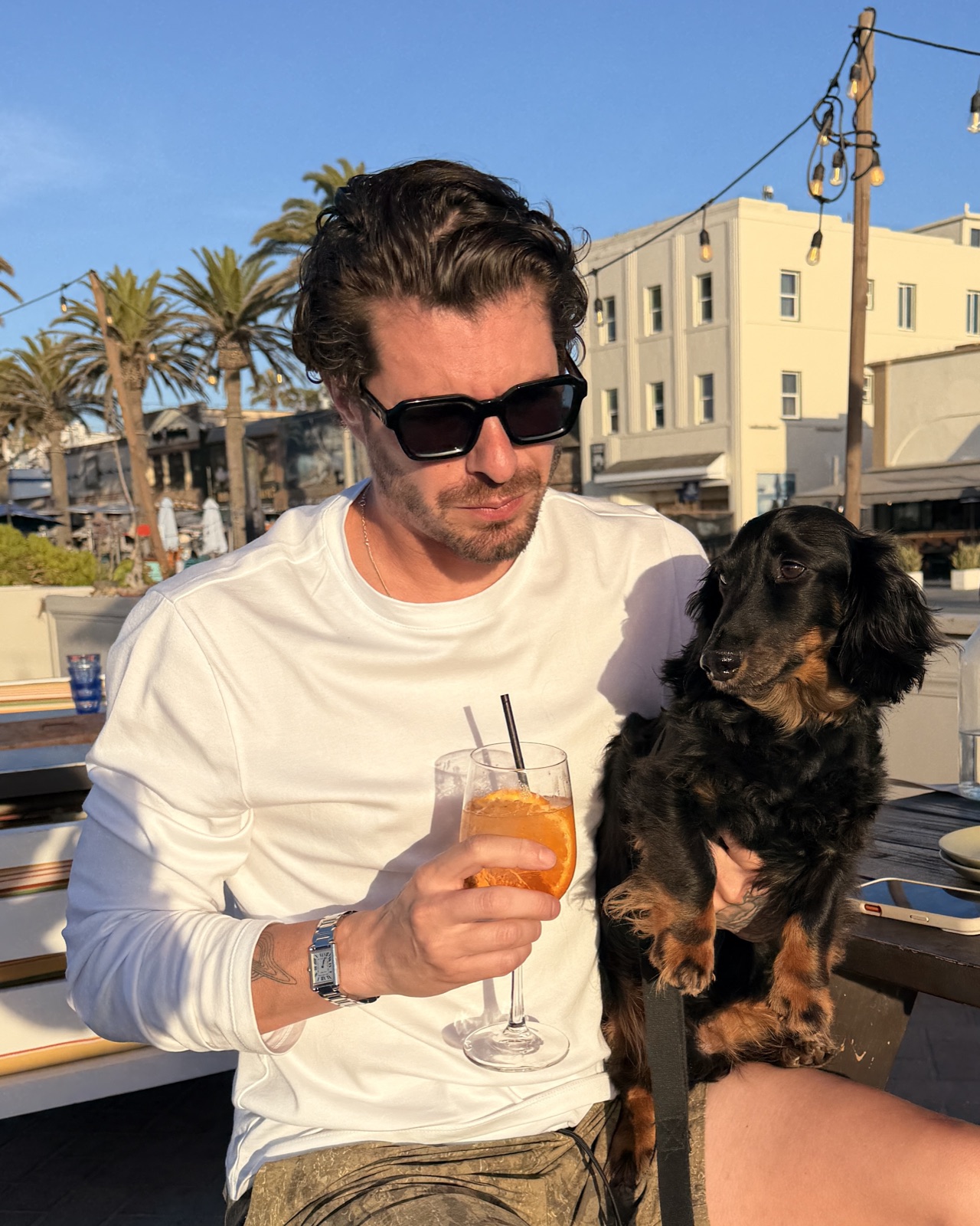 Kai Baker outdoors with his dog